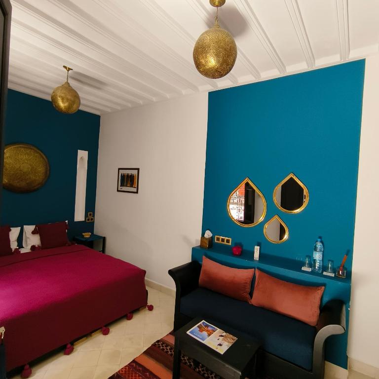Un pat sau paturi într-o cameră la Riad Mylaya