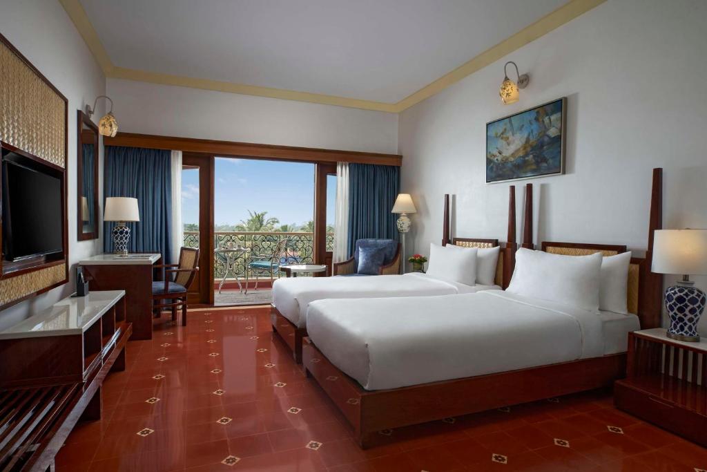 Postel nebo postele na pokoji v ubytování Radisson Blu Resort, Goa