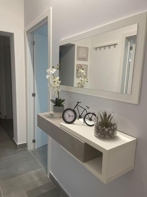 a bathroom with a sink and a mirror at Cantinho de Sagres in Sagres
