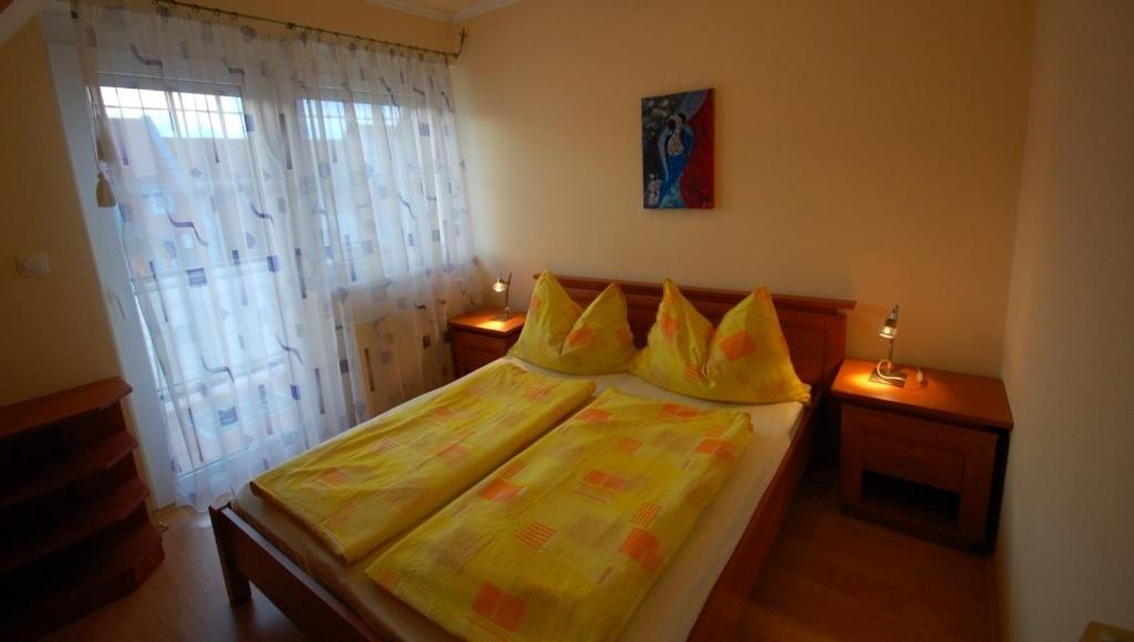 Postel nebo postele na pokoji v ubytování Gere Apartment de Luxe