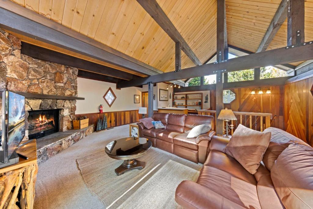 a living room with a couch and a fireplace at Nightingale Retreat - 3BR, Close to Tahoe City, Walk to Bike Path, Private Beach Access in Tahoe City