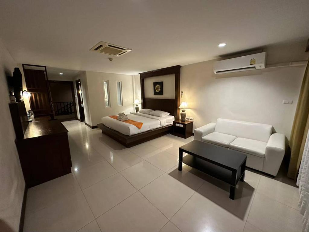 Postel nebo postele na pokoji v ubytování Baan Yuree Resort & Spa - SHA Plus