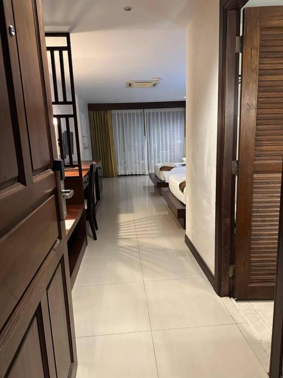 Postel nebo postele na pokoji v ubytování Baan Yuree Resort & Spa - SHA Plus
