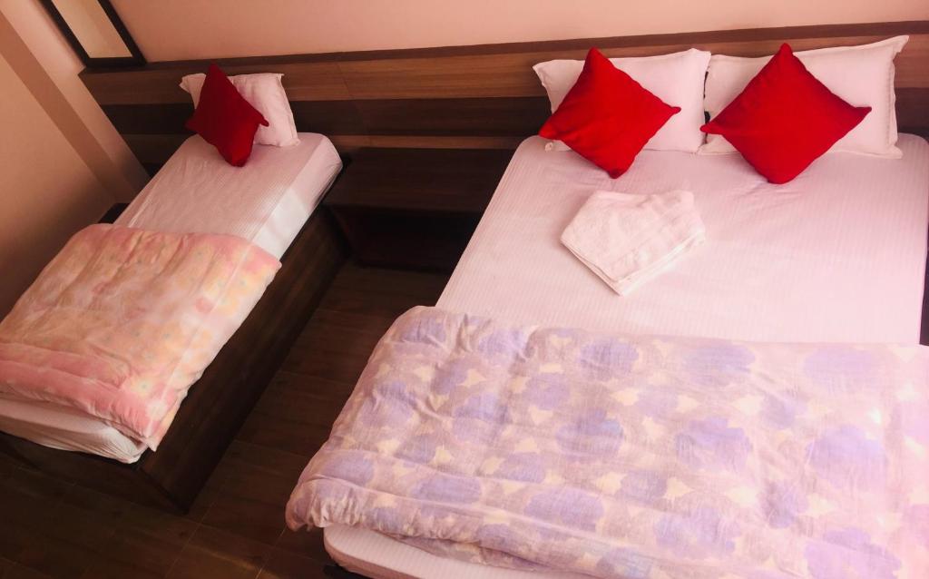 Postel nebo postele na pokoji v ubytování Hotel Rajdhani Visit