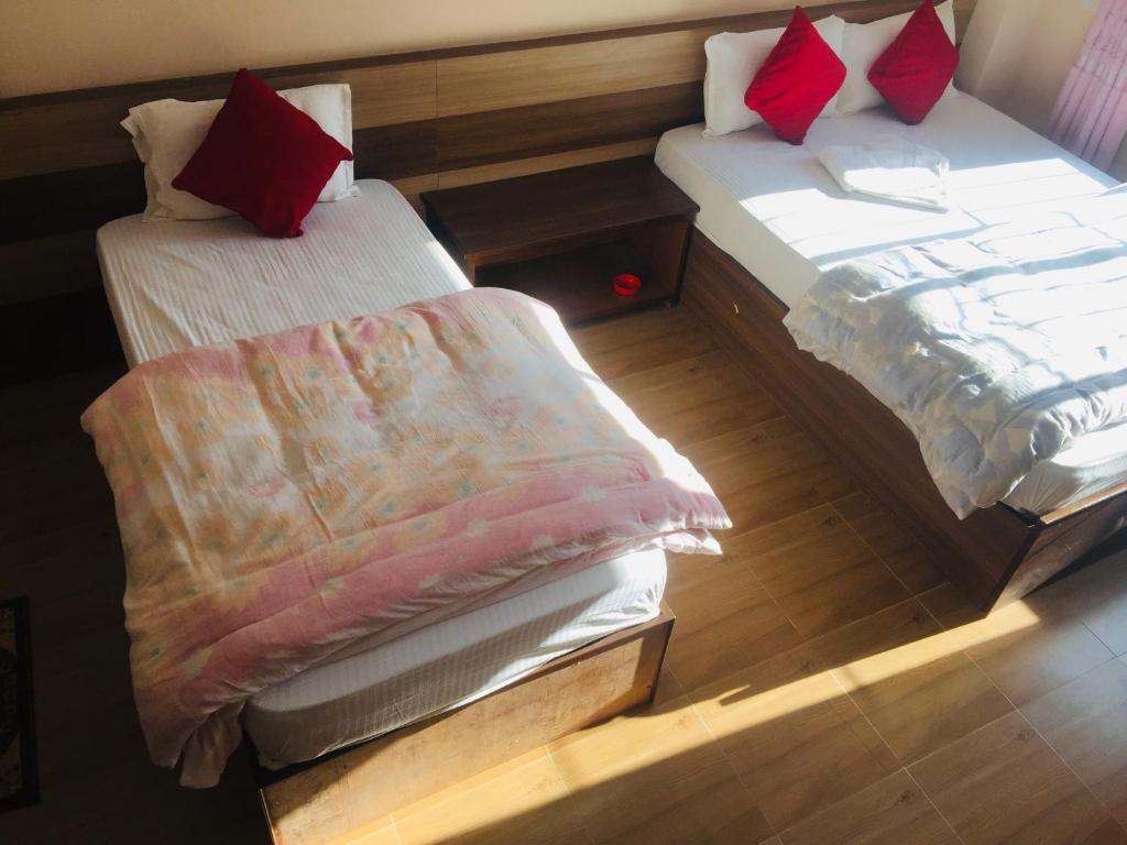 Postel nebo postele na pokoji v ubytování Hotel Rajdhani Visit