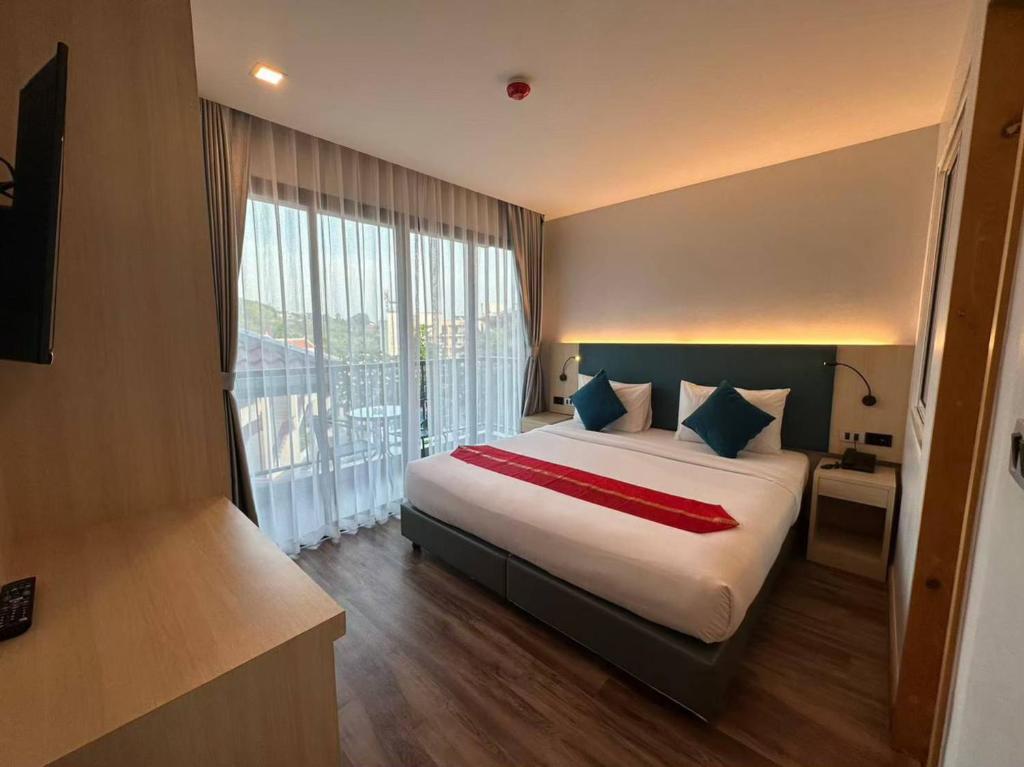 Postel nebo postele na pokoji v ubytování Baan Yuree Resort & Spa - SHA Plus