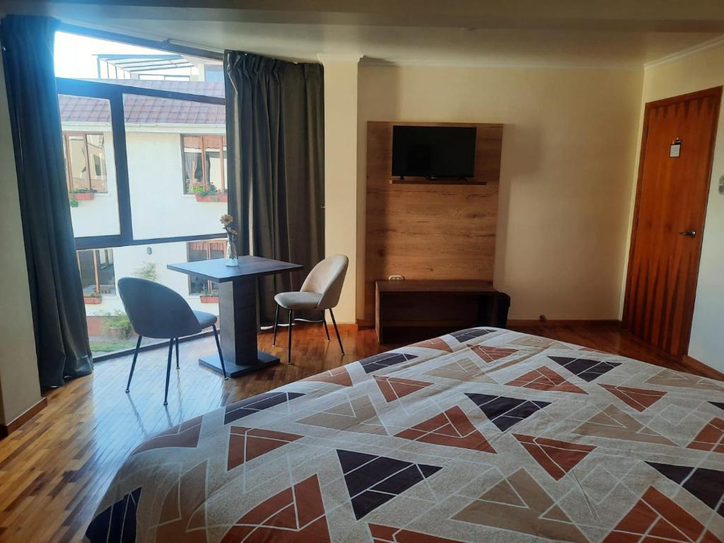 TV a/nebo společenská místnost v ubytování Hotel Rincon Aleman