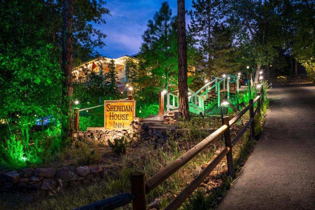 a playground in a park at night with green lights at Sheridan House Inn- Adult Only Accommodation in Williams