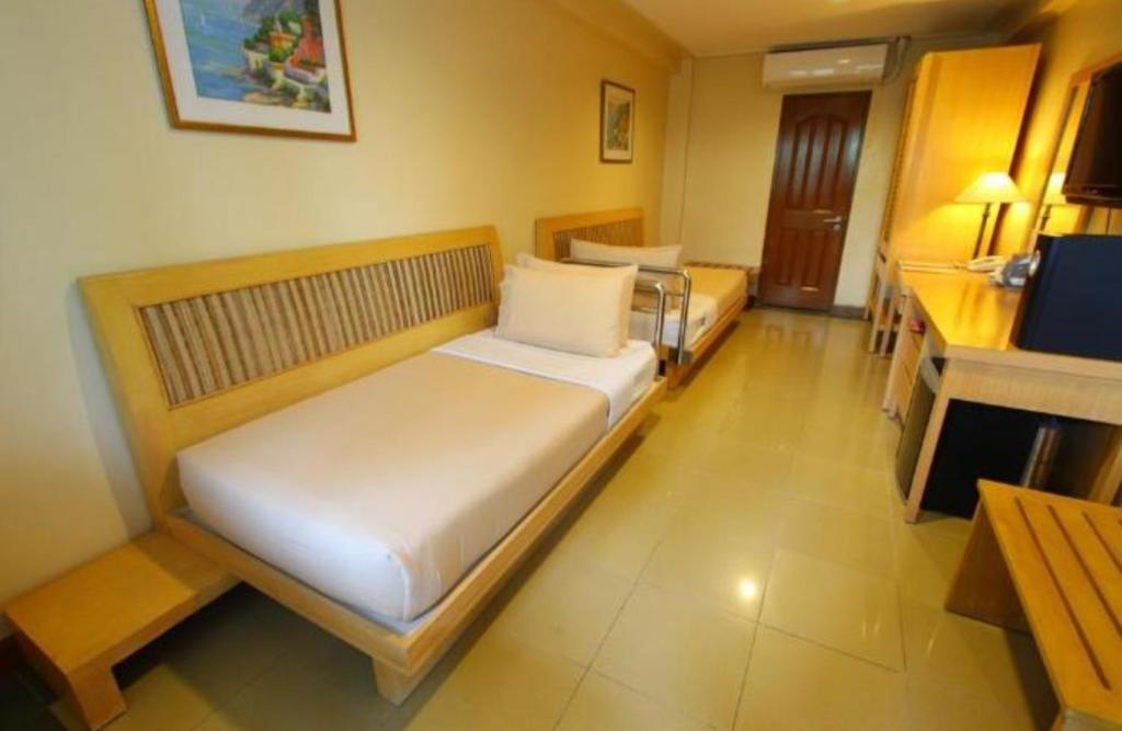 Trace Suites by SMS Hospitalityにあるベッド