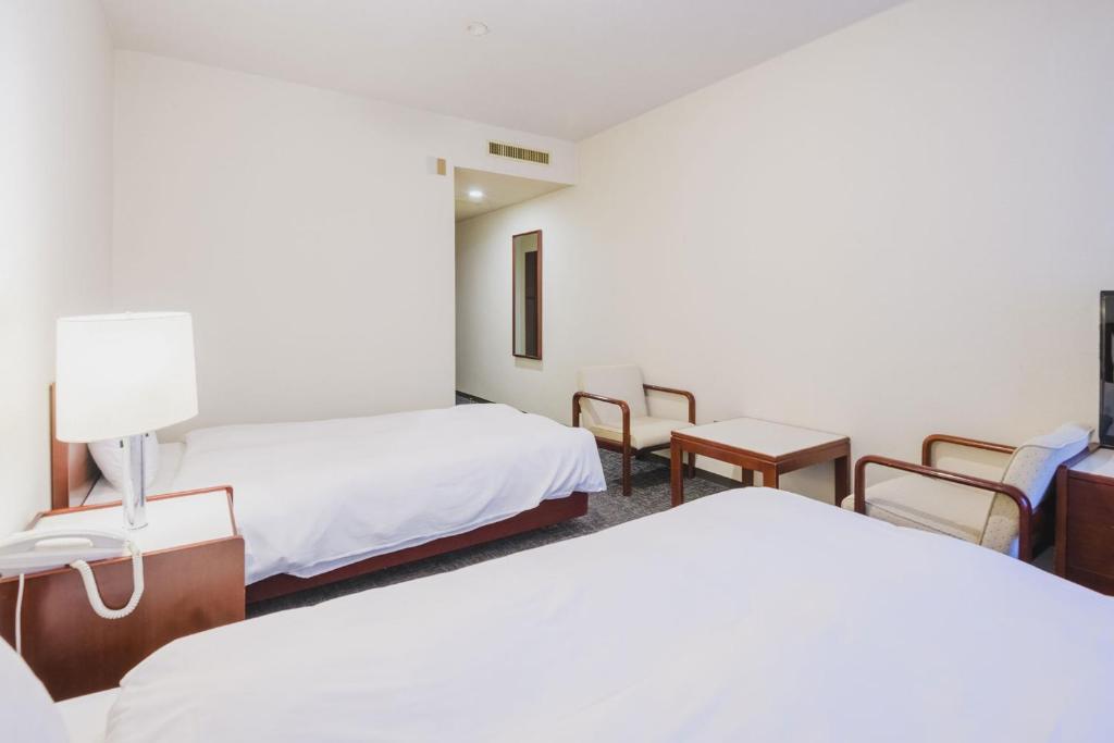 Postel nebo postele na pokoji v ubytování Ooedo Onsen Monogatari Awara