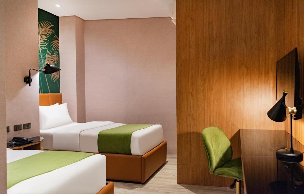 Voodi või voodid majutusasutuse Ironwood Hotel toas