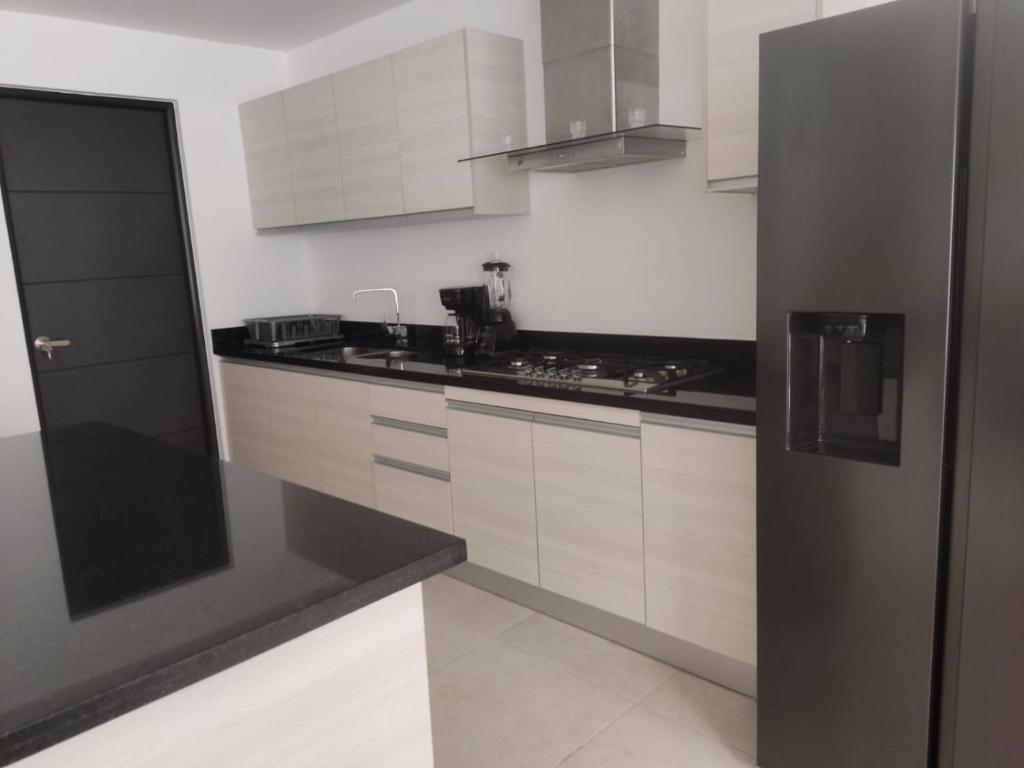 Kuchyň nebo kuchyňský kout v ubytování Casa entera de lujo Playa del Carmen