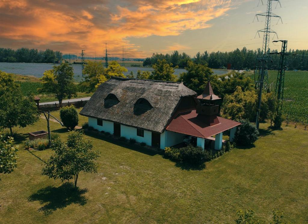 an overhead view of a small house with a roof at Enjoy the quiet nature in our unique cottage 