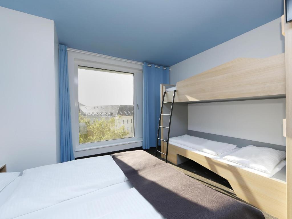 Postel nebo postele na pokoji v ubytování B&B Hotel Berlin-Tiergarten