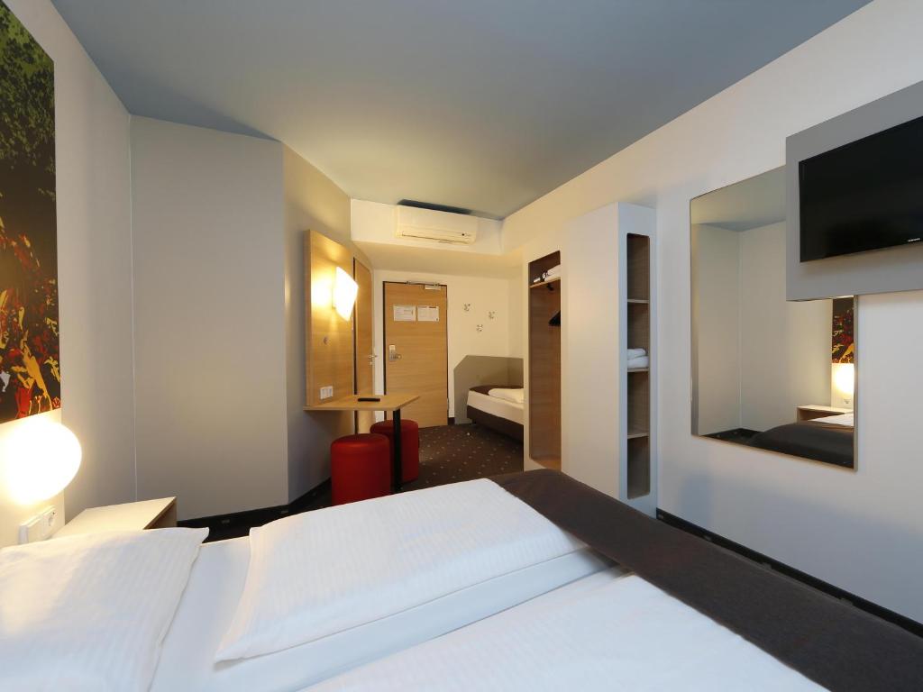 Postel nebo postele na pokoji v ubytování B&B Hotel Berlin-Tiergarten