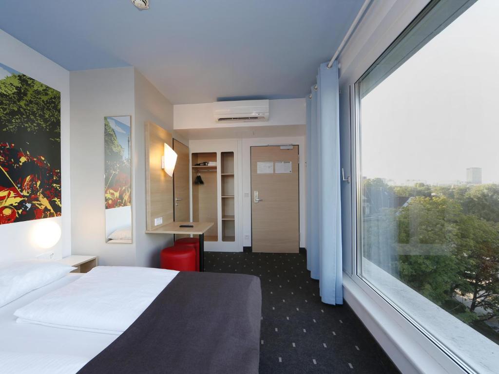 Postel nebo postele na pokoji v ubytování B&B Hotel Berlin-Tiergarten