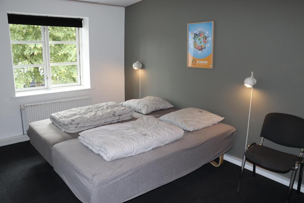 Postel nebo postele na pokoji v ubytování Danhostel Haderslev