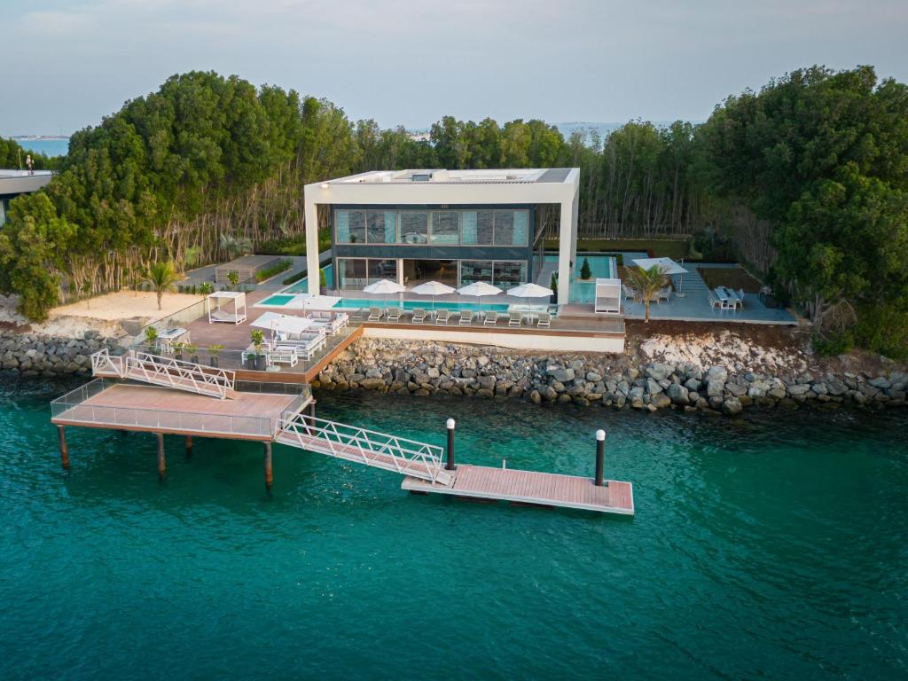 an aerial view of a house in the water at Nurai Water Villa By Luxury Explorers Collection in Abu Dhabi
