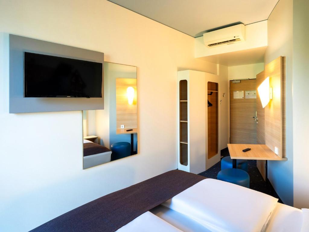 Postel nebo postele na pokoji v ubytování B&B Hotel Braunschweig-City