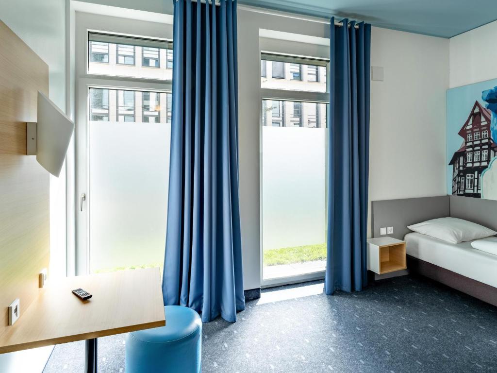 Postel nebo postele na pokoji v ubytování B&B Hotel Braunschweig-City
