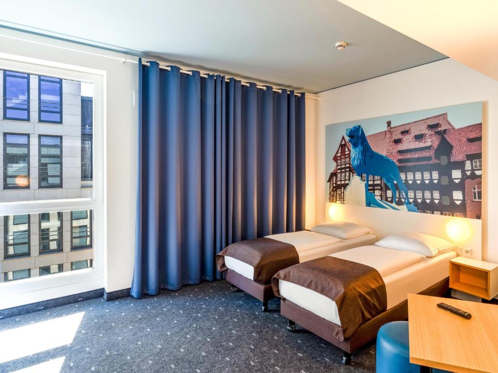 Postel nebo postele na pokoji v ubytování B&B Hotel Braunschweig-City