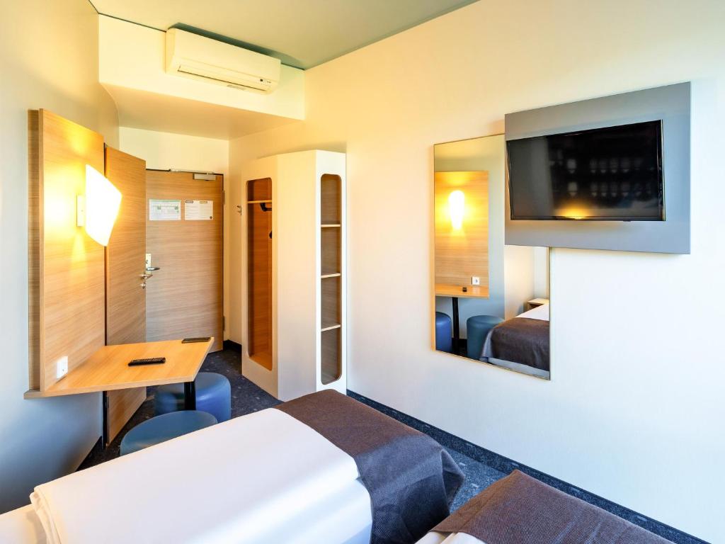 Postel nebo postele na pokoji v ubytování B&B Hotel Braunschweig-City