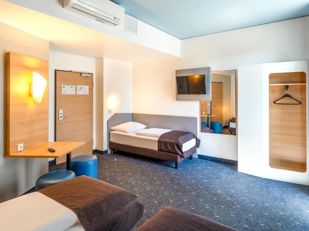 Postel nebo postele na pokoji v ubytování B&B Hotel Braunschweig-City