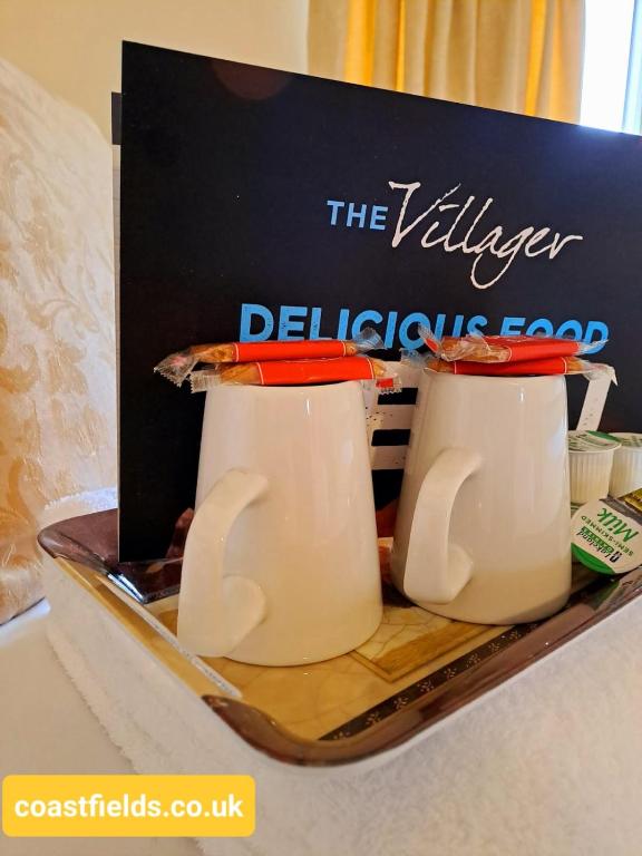 a sign that says the vilsayer dellectives food at Villager Hotel, Ingoldmells in Ingoldmells