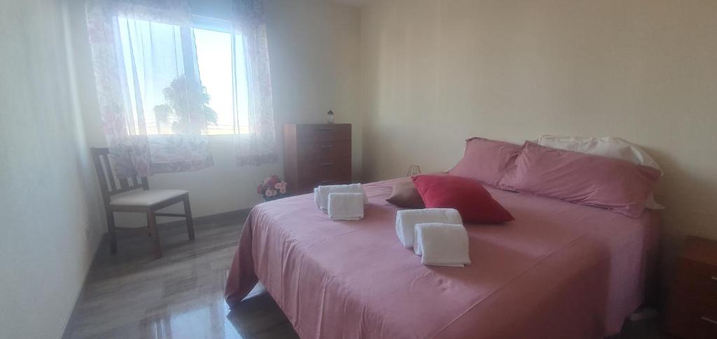 En eller flere senger på et rom på Cosy T2 in Palmela city center