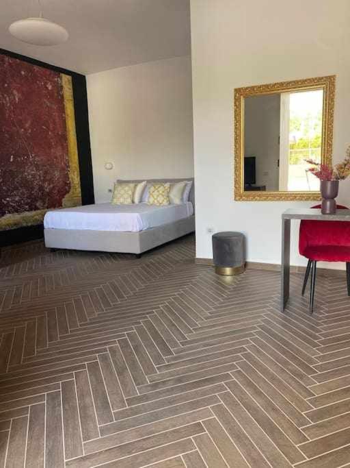 Postel nebo postele na pokoji v ubytování Residenza Agli Scavi