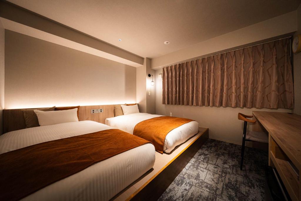 Postel nebo postele na pokoji v ubytování R Hotel Namba South