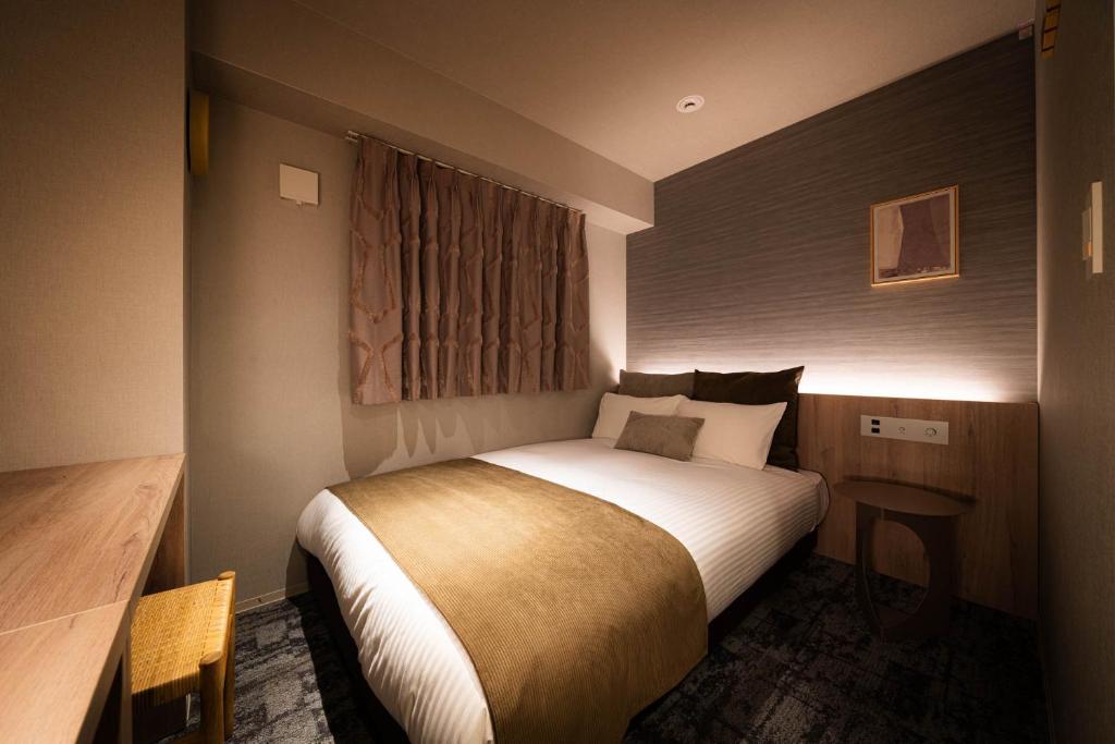Postel nebo postele na pokoji v ubytování R Hotel Namba South