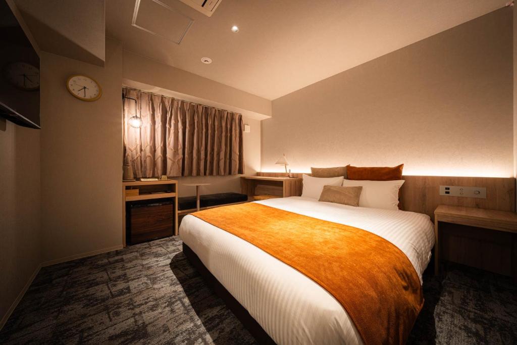 Postel nebo postele na pokoji v ubytování R Hotel Namba South