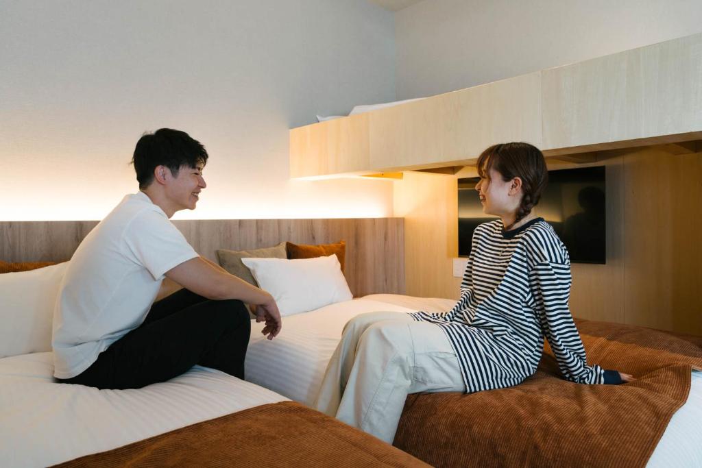 Postel nebo postele na pokoji v ubytování R Hotel Namba South
