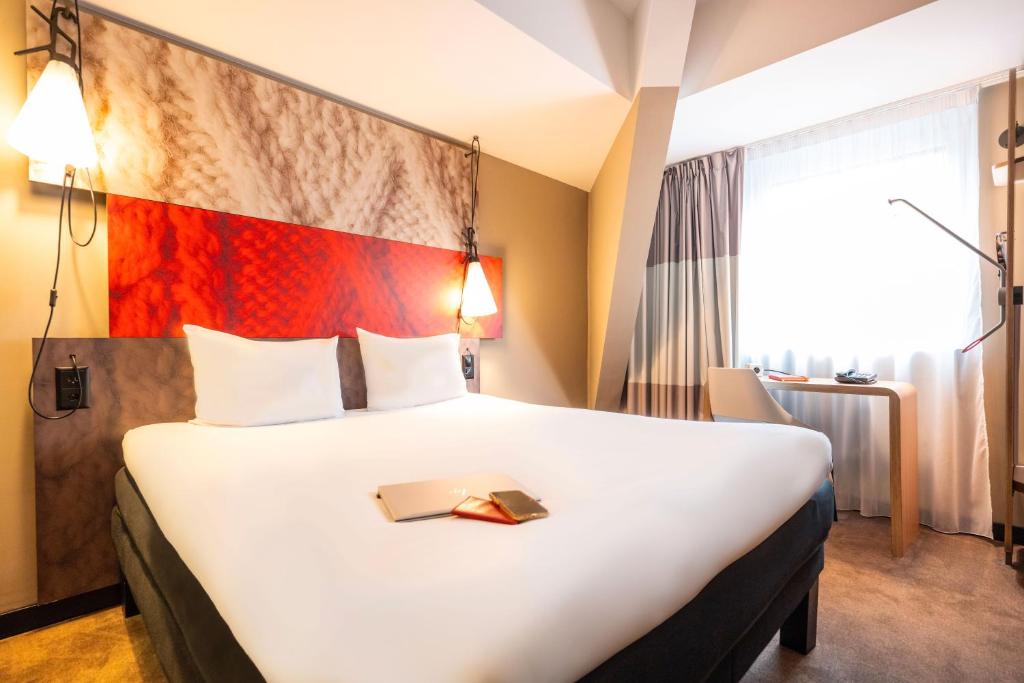 Postel nebo postele na pokoji v ubytování ibis Geneve Centre Lac