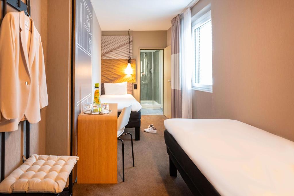 Postel nebo postele na pokoji v ubytování ibis Geneve Centre Lac