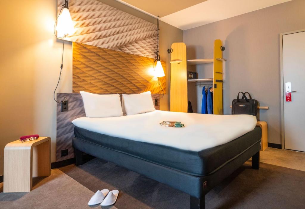 Postel nebo postele na pokoji v ubytování ibis Geneve Centre Lac