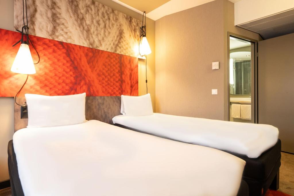 Postel nebo postele na pokoji v ubytování ibis Geneve Centre Lac