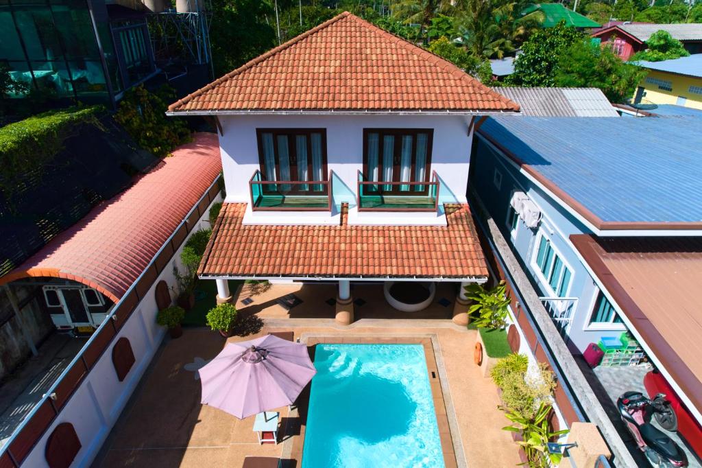 an aerial view of a house with a swimming pool at Ananda Private Pool Villa, Ao Nang in Krabi