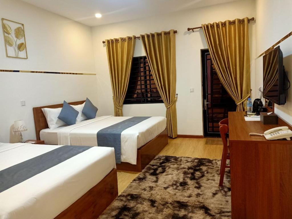 Postel nebo postele na pokoji v ubytování Nimith Hotel & Restaurant