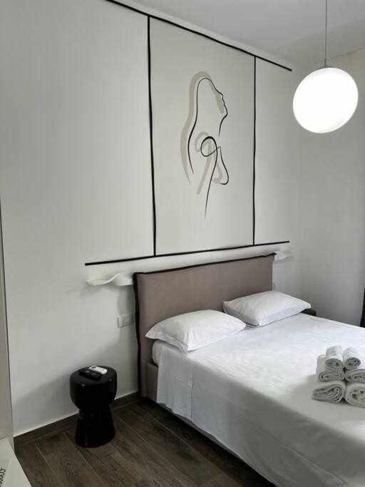 Postel nebo postele na pokoji v ubytování Dimora Al Vesuvio