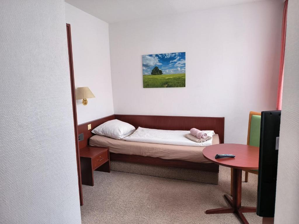 Postel nebo postele na pokoji v ubytování Zimmer am Jüdenhof
