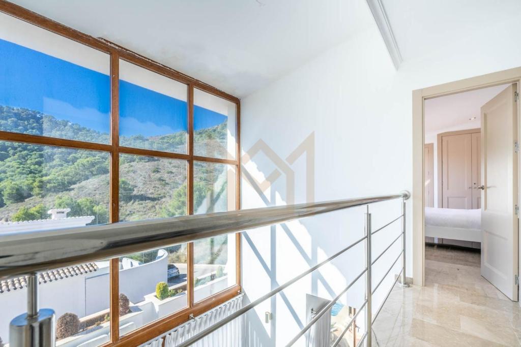 a balcony with a view of a mountain at Four Bedroom Atalayas Ii Villa - La Manga Club in Atamaría