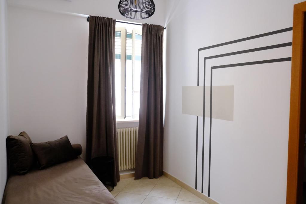 Postel nebo postele na pokoji v ubytování MATTEOTTI ROOMS