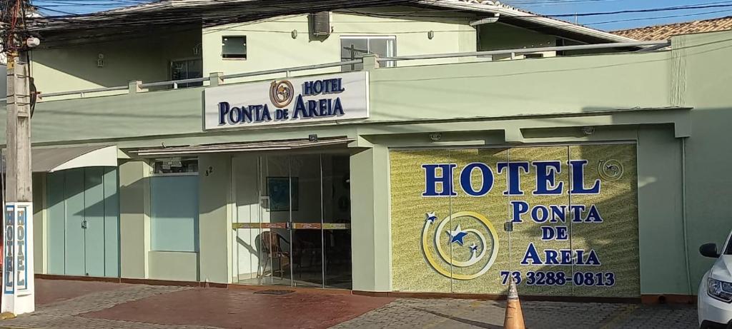 a hotel sign on the side of a building at Hotel Ponta de Areia in Porto Seguro