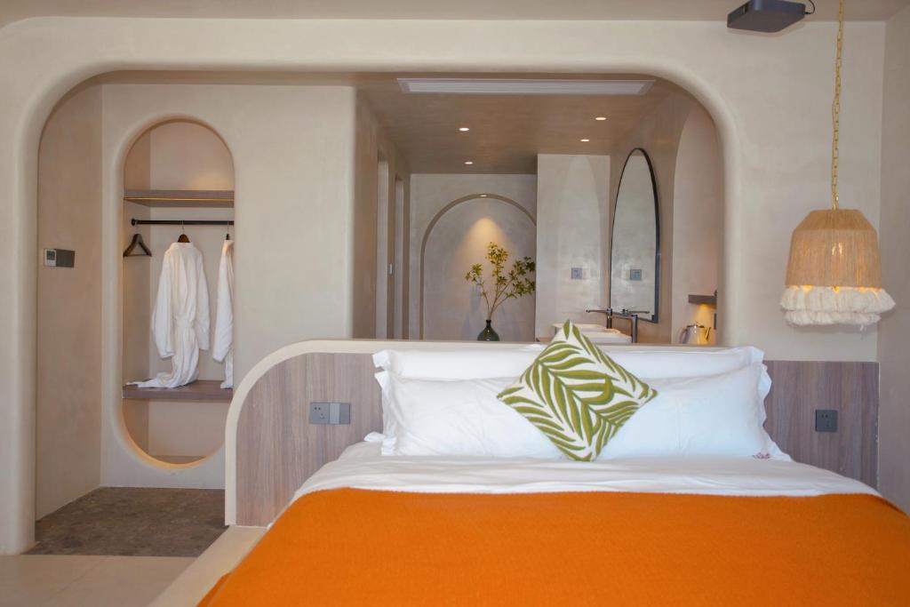 Postel nebo postele na pokoji v ubytování Shenzhen Semporna Beach Sea View B & B - 深圳较场尾仙本那沙滩海景民宿