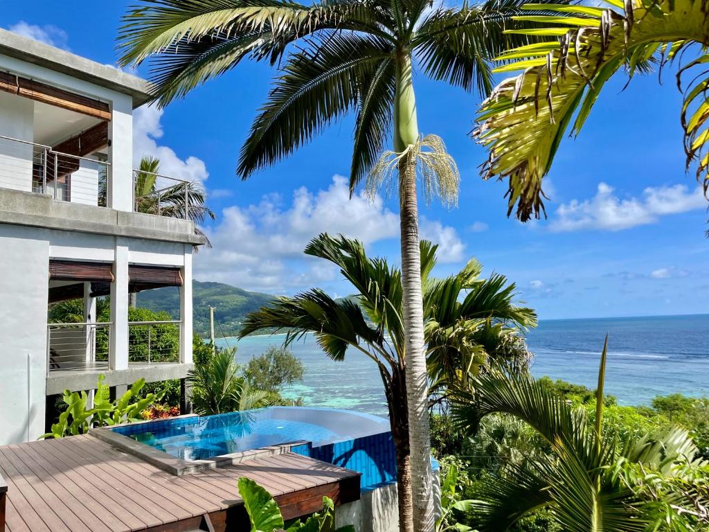 a villa with a view of the ocean at Chalets Bougainville in Takamaka