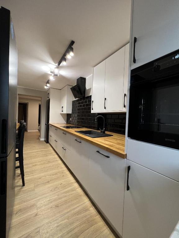 Kuchyň nebo kuchyňský kout v ubytování WOW HOME