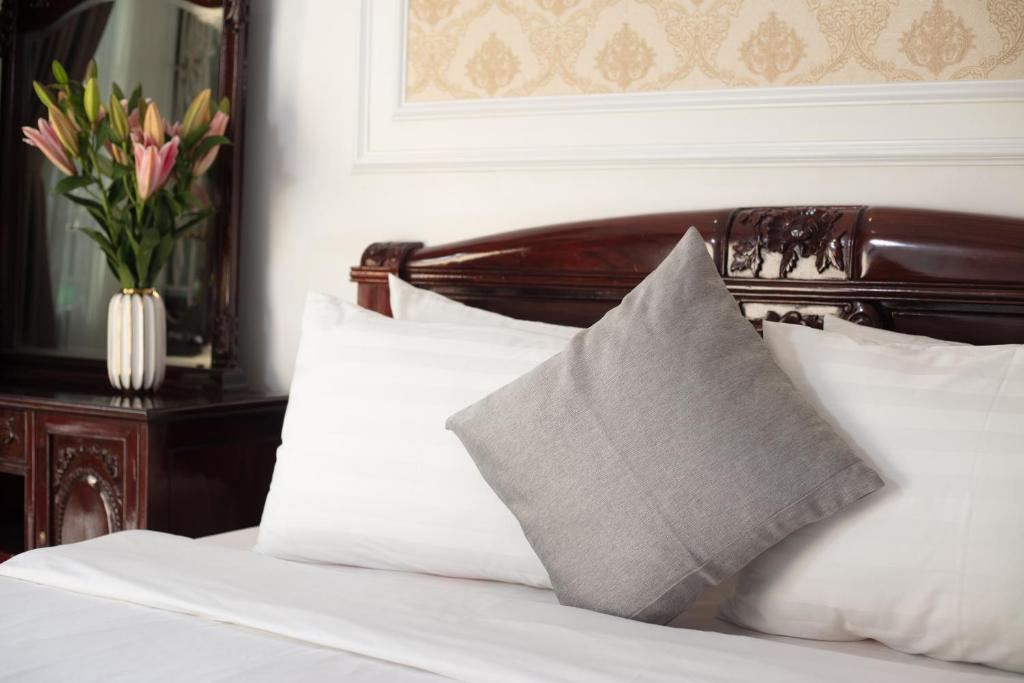 Postel nebo postele na pokoji v ubytování La Lisa Hotel