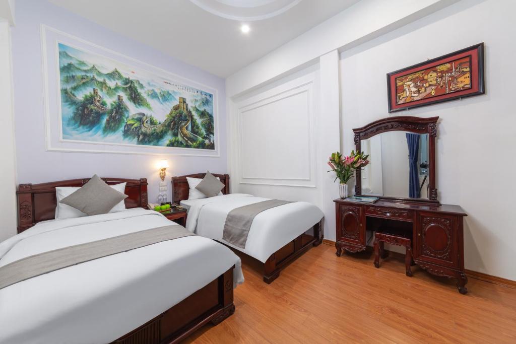 Postel nebo postele na pokoji v ubytování La Lisa Hotel